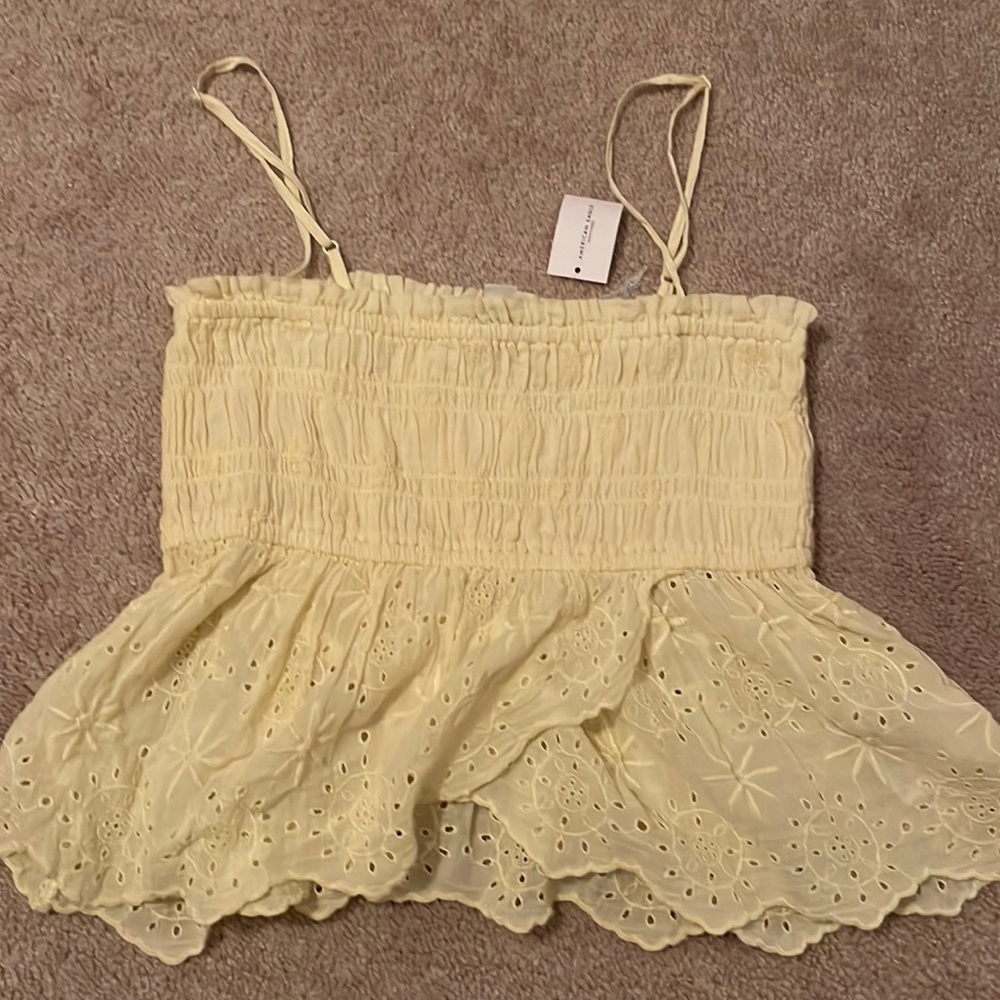 American Eagle slightly cropped top with floral print on the bottom.